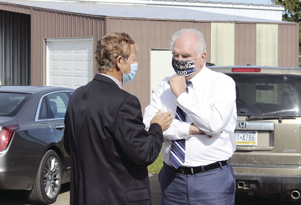 Corry Mayor Dave Mitchell, left, speaks with U.S. Rep. Mike Kelly (R-16)
